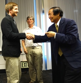 Jeff is congratulated by Chancellor Henry Yang